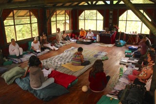 Group of people meditating in a circle